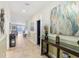 Bright and spacious entryway with tile flooring, leading to the living area and pool at 1431 Wexford Way, Davenport, FL 33896