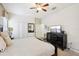 King bed, dresser, and ceiling fan in bright and airy bedroom at 1431 Wexford Way, Davenport, FL 33896