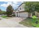 Two-story house with a two-car garage and nicely landscaped front yard at 1431 Wexford Way, Davenport, FL 33896