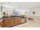 Open concept kitchen with breakfast bar and stainless steel appliances at 1431 Wexford Way, Davenport, FL 33896