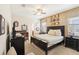 Spacious bedroom with king-size bed, crib, and en-suite bathroom access at 1431 Wexford Way, Davenport, FL 33896