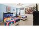 Twin-size beds with Marvel bedding and a TV at 1431 Wexford Way, Davenport, FL 33896