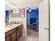 Double vanity with granite countertops, access to bedroom at 1431 Wexford Way, Davenport, FL 33896