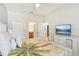 Bedroom with king-size bed, dresser, and views into bathroom and hallway at 1431 Wexford Way, Davenport, FL 33896