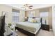 King-size bed, two nightstands, and a relaxing sitting area at 1431 Wexford Way, Davenport, FL 33896