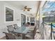 Covered patio with seating area and outdoor dining table at 1431 Wexford Way, Davenport, FL 33896