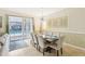 Elegant dining room with a large table, chairs, and access to the pool area at 1431 Wexford Way, Davenport, FL 33896
