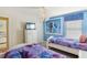 Lovely bedroom with two twin beds, Frozen mural, and plenty of closet space at 1431 Wexford Way, Davenport, FL 33896
