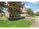 Two-story house exterior showcasing attractive landscaping and a brick driveway at 1431 Wexford Way, Davenport, FL 33896