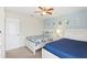 Spacious bedroom with two twin beds and a double bed, ceiling fan, and plenty of natural light at 1431 Wexford Way, Davenport, FL 33896