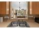 Kitchen sink with view into living room at 8101 Coconut Palm Way # 203, Kissimmee, FL 34747