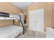 Bedroom with full-over-full bunk bed, and access to a hallway bathroom at 8101 Coconut Palm Way # 203, Kissimmee, FL 34747