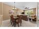 Bright dining area with glass-top table and wicker chairs at 8101 Coconut Palm Way # 203, Kissimmee, FL 34747