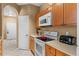 Well-equipped kitchen featuring modern appliances and ample cabinetry at 8101 Coconut Palm Way # 203, Kissimmee, FL 34747