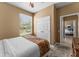 Bedroom with double bed, built-in closet, and view into another bedroom at 8101 Coconut Palm Way # 203, Kissimmee, FL 34747