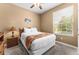 Bedroom with double bed, nightstand, and window at 8101 Coconut Palm Way # 203, Kissimmee, FL 34747