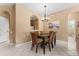 Open dining area with view into kitchen and hallway at 8101 Coconut Palm Way # 203, Kissimmee, FL 34747