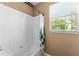 Simple bathroom with shower/tub combo and window at 8101 Coconut Palm Way # 203, Kissimmee, FL 34747