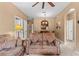 Spacious living room with brown couches and access to hallway at 8101 Coconut Palm Way # 203, Kissimmee, FL 34747