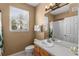 Clean bathroom with double vanity, toilet and shower/tub combo at 8101 Coconut Palm Way # 203, Kissimmee, FL 34747
