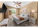 Spacious bedroom with a king-size bed and plenty of natural light at 8101 Coconut Palm Way # 203, Kissimmee, FL 34747