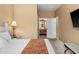 Main bedroom with ensuite bathroom access and a comfortable sitting area at 8101 Coconut Palm Way # 203, Kissimmee, FL 34747