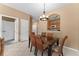 Dining area with kitchen pass-through and six chairs at 8101 Coconut Palm Way # 203, Kissimmee, FL 34747