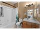 Clean bathroom with a tub shower combination and double vanity at 8101 Coconut Palm Way # 203, Kissimmee, FL 34747