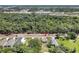 Aerial view showcasing a house's location on a tree-lined street at 702 S Myrtle Ave, New Smyrna Beach, FL 32168