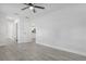 Spacious bedroom with ceiling fan and access to bathroom at 702 S Myrtle Ave, New Smyrna Beach, FL 32168