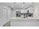 Modern kitchen with white cabinets and a blue dishwasher at 702 S Myrtle Ave, New Smyrna Beach, FL 32168