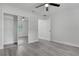 Bedroom with mirrored closet doors and wood-look floors at 702 S Myrtle Ave, New Smyrna Beach, FL 32168