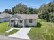 House exterior with driveway and landscaping at 702 S Myrtle Ave, New Smyrna Beach, FL 32168