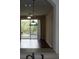 Kitchen view of living room and balcony access at 6214 Stevenson Dr # 201, Orlando, FL 32835