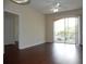 Living room with hardwood floors and access to balcony at 6214 Stevenson Dr # 201, Orlando, FL 32835