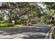 Gated community entrance with lush landscaping at 6214 Stevenson Dr # 201, Orlando, FL 32835