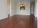 Dining room with hardwood floors and kitchen pass-through at 6214 Stevenson Dr # 201, Orlando, FL 32835