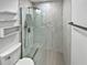 Modern bathroom with frameless shower and floating shelves at 4350 Perkinshire Ln # 111, Orlando, FL 32822