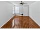 Bedroom with wood-look tile floors and ceiling fan at 4350 Perkinshire Ln # 111, Orlando, FL 32822