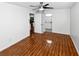 Bright bedroom with wood-look floors and bathroom access at 4350 Perkinshire Ln # 111, Orlando, FL 32822