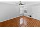 Spacious bedroom with wood-look tile floors and ceiling fan at 4350 Perkinshire Ln # 111, Orlando, FL 32822