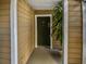 Condo building entryway with a dark brown door at 4350 Perkinshire Ln # 111, Orlando, FL 32822