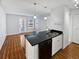 Kitchen with granite countertops, white cabinets, and a breakfast bar at 4350 Perkinshire Ln # 111, Orlando, FL 32822