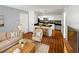 Living room with open concept kitchen, hardwood floors, and modern decor at 4350 Perkinshire Ln # 111, Orlando, FL 32822