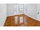 Bright living room featuring wood-look tile floors and sliding glass doors at 4350 Perkinshire Ln # 111, Orlando, FL 32822