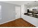 Living room with hardwood floors and open kitchen at 4350 Perkinshire Ln # 111, Orlando, FL 32822