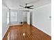 Bright bedroom with hardwood floors and ceiling fan at 4350 Perkinshire Ln # 111, Orlando, FL 32822