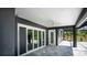 Spacious covered patio with tiled flooring and sliding glass doors at 17694 Sw 61St Lane Rd, Dunnellon, FL 34432