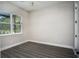 Bright bedroom with wood-look floors and large window at 17694 Sw 61St Lane Rd, Dunnellon, FL 34432