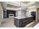 Modern kitchen with large island, stainless steel appliances and fireplace at 17694 Sw 61St Lane Rd, Dunnellon, FL 34432